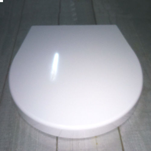 Tapa + asiento inodoro en resina modelo Poing serie Poing, acabado en blanco brillo.